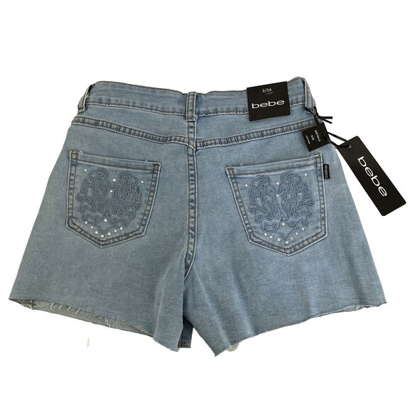 New Women’s Bebe Denim Shorts Stone Embroidered Sz 2 (26) NWT Light Wash Raw Hem - Picture 1 of 9